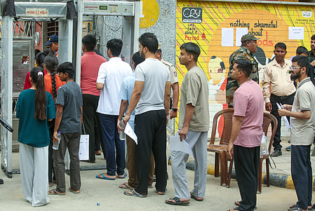 New Delhi: Candidates stand in a queue before entering Gargi Sarvodaya Kanya Vidyalaya ahead of the NEET UG 2026 re-exam at Green Park in New Delhi on Sunday, June 21, 2026. (Photo: IANS/Prem Nath Pandey)