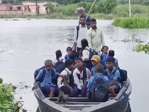 Bihar students navigate swollen rivers to reach school