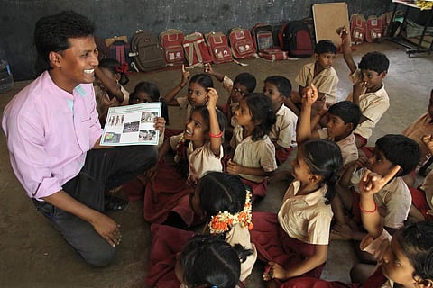 Arockiaraj is super-animated when he spends time teaching his children at Konerikuppam | Pics:  G Pattabi Raman