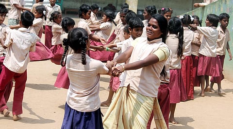 Mahalakshmi playing with her students at Government Tribal Residential Middle School, Arasavalli | Pics: Dinesh Kumar