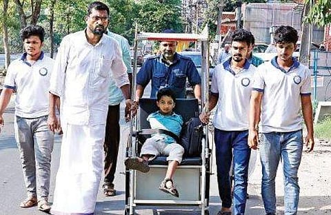 12-year-old Mohammed Asim undertook a 24-day-long 'yatra' on a wheelchair to protest against Kerala government  (Pic: Express)