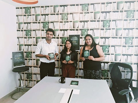 Ambika with the copy of her book