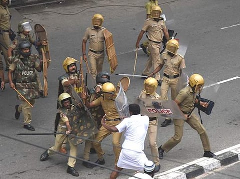 Police lathicharge a Youth Congress worker after their protest march to the Secretariat turned violent on Monday (Pic: Express)