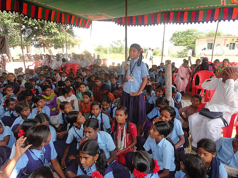 A school girl expressing the issues they face during one of the Grama Sabhas