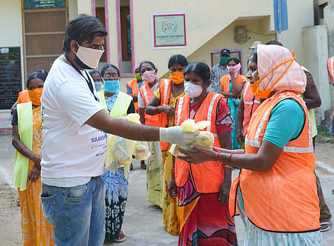 Santhosh during distribution | (Pic: Sulakshya Seva Samithi)