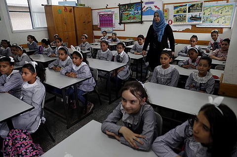 Students sit at their class on the first day of the new school year at the United-Nation run Elementary School at the Shati refugee camp in Gaza City (Pic: PTI)