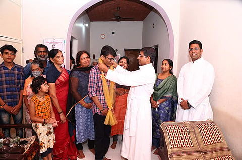 Gowrishankar S being felicitated by Principal Father Scaria Etherett at his home | Pic: Sourced