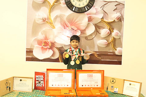 Anirudh with his certificates