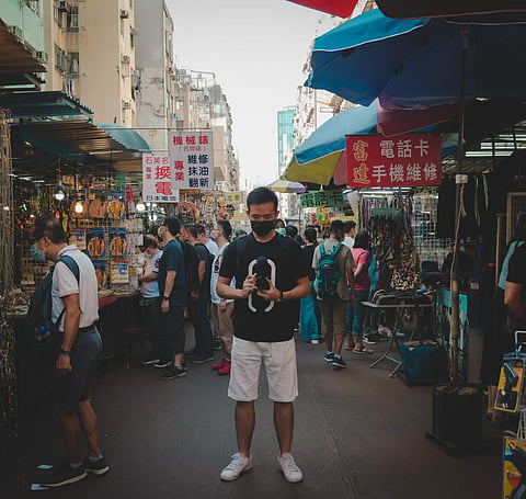 Lo Chiu Pang Jack films on the streets of Hong Kong | Pic: Project Hope