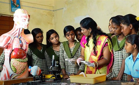 Surekha involved in showing experiments to children (Picture: Ministry of Education website))