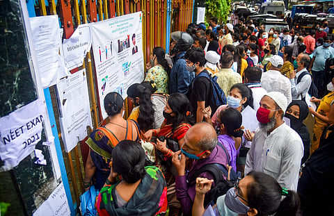 Mumbai: Students with their parents, arrive to appear for NEET exam at Thakur College at Kandivali, in Mumbai, Sunday, September 12, 2021 | Pic: PTI