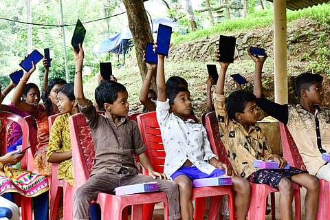 The tribal kids with their tablets | Pic courtesy: V Ummer Koya