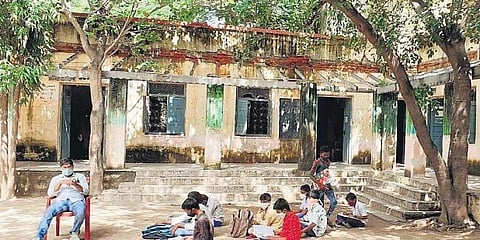 A teacher of Zilla Parishad Secondary School - Girls at Gokulnagar in Jangaon town conducts a class in the playground | Pic: Express