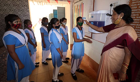 Students undergoing thermal scanning | Pic: EdexLive