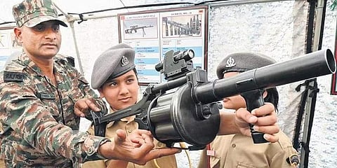A girl cadet handles a military weapon at the Rashtriya Military School in Bengaluru | Pic: Shashidhar Byrappa