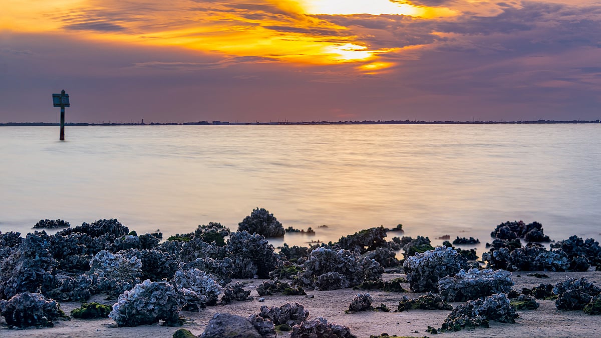black stones in sea beach