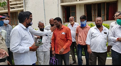 protesting workers of tanpure sugar factory put black oil on face of pravara factory official 