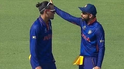 Rahul Chahar and Virat Kohli 