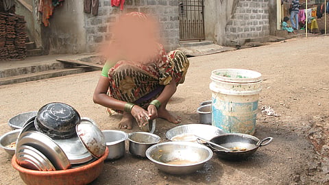 Old women cleanning pots