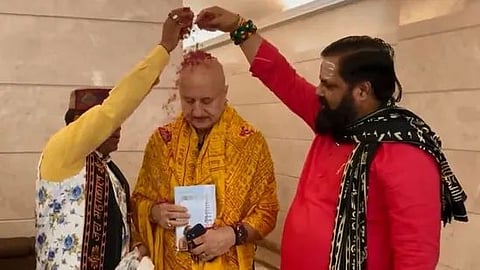 People performing puja for Anupam Kher at his residence. 