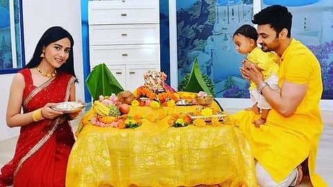 Amrita Rao with husband RJ Anmol and son Veer during a puja. 
