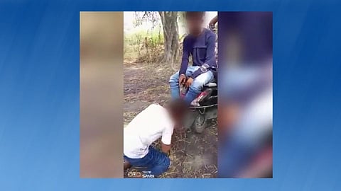 Boy forced to lick feet