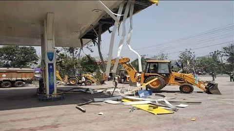 samajwadi party mla petrol pump bulldozed after threats to up cm yogi adityanath  