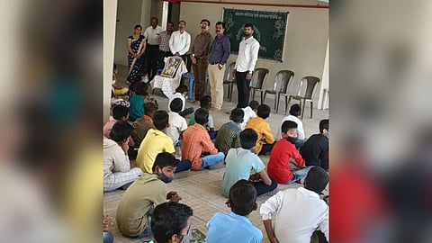 Honored by giving marksheet to students Maharashtra Day in school undri