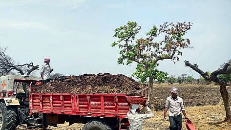 Latur farm manure process with help of tractor 
