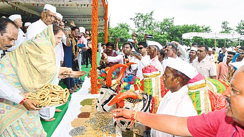 Jyoti and Ashok Jain worshiping Sarjaraja on the occasion of Polana celebrated at Jain Hills. Along with other members and dignitaries.