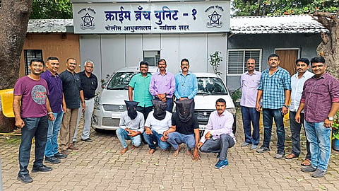 Police team with arrested suspects.