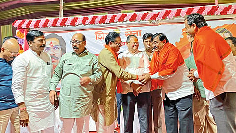 Founding President Baban Gholap while giving the sources of NMC Employees Workers Union to Shiv Sena Metropolitan Chief Sudhakar Badgujar.