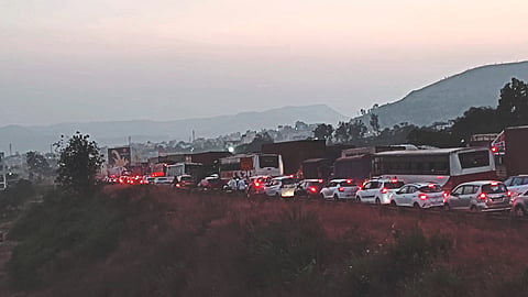 Traffic jam on the bridge between Sinnar Phata and Khambale Shivara on Sunday.