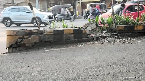 Cracks in the divider due to frequent vehicle collisions.