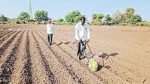 Rajendra Patil while sowing wheat with tiller 