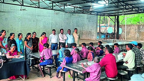Teachers and officials present when the students freed from poverty in the primitive Katkari community of Ubhade settlement join the ashram school.