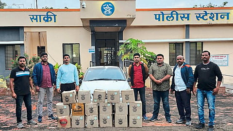 Team present with liquor seized by LCB.