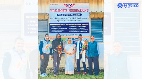 While felicitating player Dilip Gavit and guide Vaijnath Kale, President of Dang Seva Mandal Hemlata Bidkar, Principal Dr. R. B. Toche, Sports Director Dr. Narendra Patil.