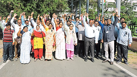 Employees of Public Works Department during pen bandh protest on the premises of Collector Office on Monday.