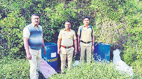 Sub-inspector Navnath Rasal and police personnel while raiding the unauthorized hand furnace from the drain and destroying the chemical on the spot.