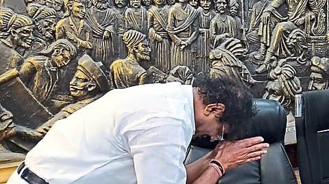 Pradeep Karpe bowing before the mayor's chair in the municipal corporation on Monday.