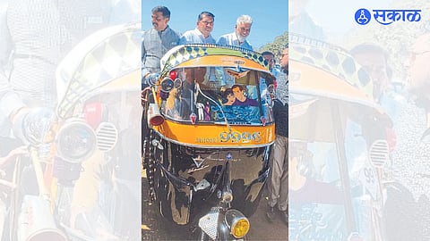 Bhausaheb Chaudhary along with Guardian Minister Dada Bhuse taking a ride in a rickshaw decorated on the occasion of the Rickshaw Beauty Contest.