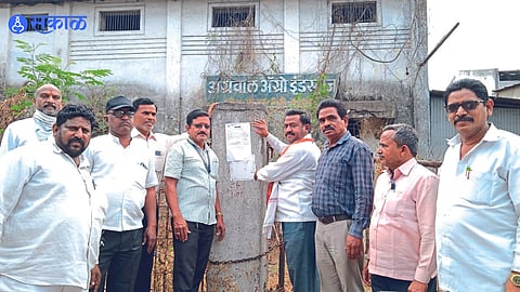 Municipal staff while serving seizure notice on a company in an industrial estate
