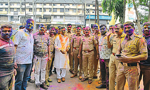 Superintendent of Police and staff playing dhulivandan at city police station.