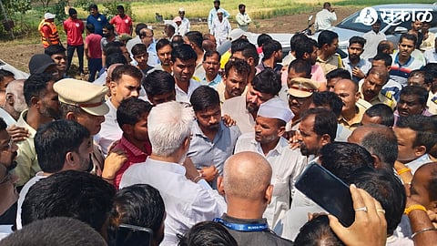 Villagers gathered around dada bhuse