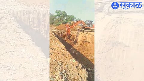 Excavation in progress with JCB for biogas plant at municipal site on Varkhedi Road.