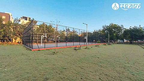 Park lawn and basketball court.