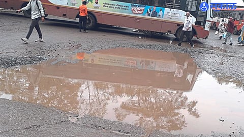 Ponds filled with rainwater at the entrance of the bus stand.