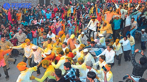 Sitaram Bhagat and devotees pulling baragadi langad on the occasion of Khanderao Maharaj Yatrotsava.
