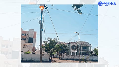 A street lamp running during the day in Prerna Colony area here.
